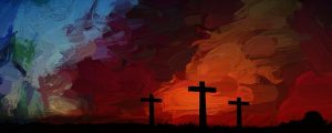 Three crosses against a dark sky